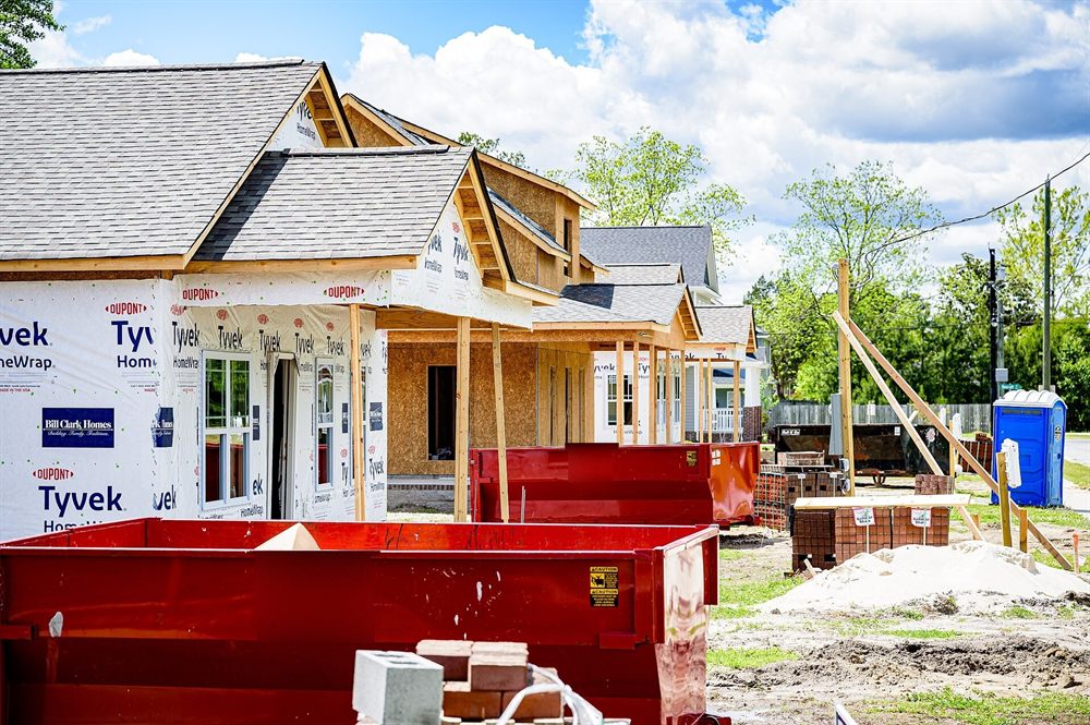 New home construction site with roll-off dumpsters